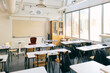© Maskot - Empty desks and chairs in classroom at junior high school