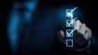 © Zarana  - Business person selecting checklist with finger, digital concept