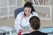© auremar - a female doctor and patient