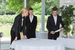 © auremar - young waiters learning how to set-up a table