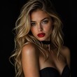 © DnQajik - Studio portrait of a stunning young woman with long wavy blonde hair striking blue eyes bold red lipstick black choker and strapless black dress against a dark background