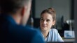 © DaniLana - One-on-one meeting with a manager giving constructive feedback
