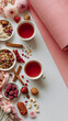 © Benjaporn - Womens health wellness table with herbal tea calcium rich foods berries nuts yoga mat and flowers for hormone balance and healthy aging