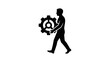© jongaNU - A silhouette of a man holding gear.