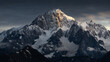 © Travel 'n' Lifestyle - View of the majestic snow-covered peaks of the Mont Blanc massif illuminated by golden sunset light under a dramatic sky in Aosta Valley, Italy.