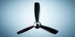 © Yevheniiya - Modern three-blade ceiling fan with sleek black blades and metallic central hub