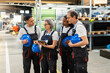 © BusinessClass by W61 - Industrial team discussing project on tablet in factory warehouse