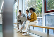 © BusinessClass by W61 - Business team collaborating and discussing ideas in modern office