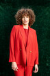 © VISTA by Westend61 - Fashion model posing in orange blazer outdoors