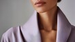 © Hot - Close up portrait of woman wearing elegant lavender outfit, clean light gray background, luxury beauty and fashion editorial aesthetic, visible