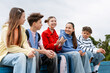 © Maria Vitkovska - Diverse teenagers sharing friendship and communication outdoors