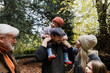 © Westend61 - Happy multi generational family together outdoors in autumn woods