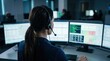 © OlenaSpark - Woman operator monitoring multiple screens in emergency dispatch room. Concept of 24 hour support, public safety, roadside assistance, control center work, crisis response and service tracking.