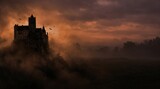 Dramatic gothic castle silhouette against a stormy sunset sky with fog and flying bats halloween aesthetic