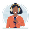 © weddy - Woman with headphones and microphone recording a podcast