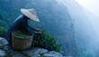 © Estd - A solitary tea worker in a traditional hat harvests fresh leaves on a misty mountainside during a rain shower, showcasing dedication and natural beauty.