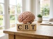© MdMasud - Cognitive Behavioral Therapy Brain Model on Wooden Desk