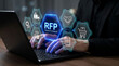 © Sonia - Businessperson using laptop for RFP request for proposal procurement process