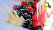© Alexander - Fresh watermelon, melon, strawberry and cherry pieces garnished with mint leaves, dusted with powdered sugar, arranged on white plate with serving skewers