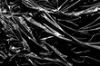© Kwangmoozaa - transparent plastic film wrap overlay texture on black background