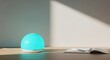 © Lau - Minimalist Glowing Blue Device with Shadows on a Desk Surface