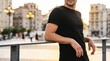 © ENDRA - Casual man in urban setting during sunset with cityscape background