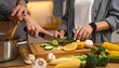 © Snap Logic - Close-up of hands chopping fresh cucumber on a wooden board surrounded by colorful vegetables