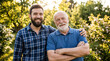 © Air stock - Happy Father and Adult Son Standing Together Outdoors, Multi-Generational Family Portrait Showing Love, Bonding and Happiness in Nature