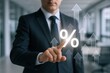 © The Little Hut - Businessman pointing at glowing percentage symbol with upward trending arrows symbolizing financial growth and success