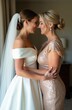 © Maryna - Bride and mother share tender moment nose to nose. Woman in wedding gown and veil hugs mother in shimmering dress. Happy family celebrating big event together with love.