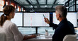 © Andrey Popov - Two IT Support Specialists Work Together Using Software
