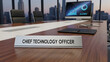 © Lang - Professional desk nameplate identifying the Chief Technology Officer inside a sleek modern conference room for corporate executive leadership and high-level management strategy sessions.