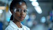 © Teh - A young woman in safety goggles and lab coat (1)