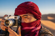 © Cavan Images - photographer with rangefinder camera in the Sahara