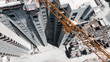 © VisualTreat12 - Top Down View Of Tower Crane Over High Rise Building Under Construction