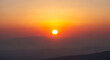© MDMAHFUZULALAM - Setting sun over mountainous terrain warm orange and red atmospheric photo sunset
