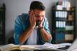 © djile - Stressed businessman suffering from headache and occupational burnout