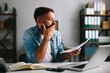 © djile - Man worrying about financial problems and paperwork