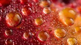 A macro close-up of juice droplets on fruit surface with strong highlights
