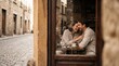 © Luz - A joyous young couple sharing a laugh while sitting at a table with coffee inside a cozy cafe, seen through a window in a charming European cobblestone street.