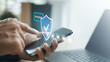 © Garun Studios - User verifying secure login on a smartphone with OTP authentication and digital security shield, representing cybersecurity, identity protection, account verification, and secure online access.