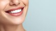 © Prapan - Radiant Smile: A close-up captures a woman's beautiful, bright white smile, showcasing healthy teeth and luscious lips against a soft, serene background.