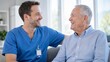 © amusto - Cheerful Male Nurse Laughing with Senior Patient During Home Care Visit