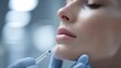 © AI Clips - Closeup of cosmetic procedure dermal filler injection being administered to a womans chin area by a gloved hand