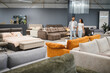© Serhii - Young couple shopping furniture in modern showroom