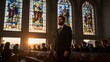 © mihrzn - A bearded man in a suit stands solemnly inside a church as sunlight streams through stained glass windows.