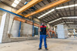 © Antonio Recena - Worker in concrete structures factory in wide angle image with work uniform.