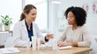 © Elysian Essence - Vitiligo skincare options clinic, Dermatologist patient discussion, Unbranded cream containers, Treatment planning close up, Clean healthcare table