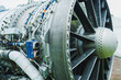 © DSMT - Close view of a large aircraft jet engine with complex components, taken at an airport during daylight
