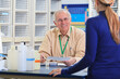 © Connect Images - Engineering professor discussing laboratory report with a student in chemical laboratory